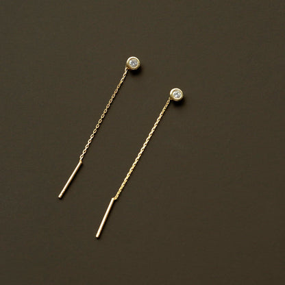 Boucles d'oreilles en fil de solitaire en or massif 14 carats.