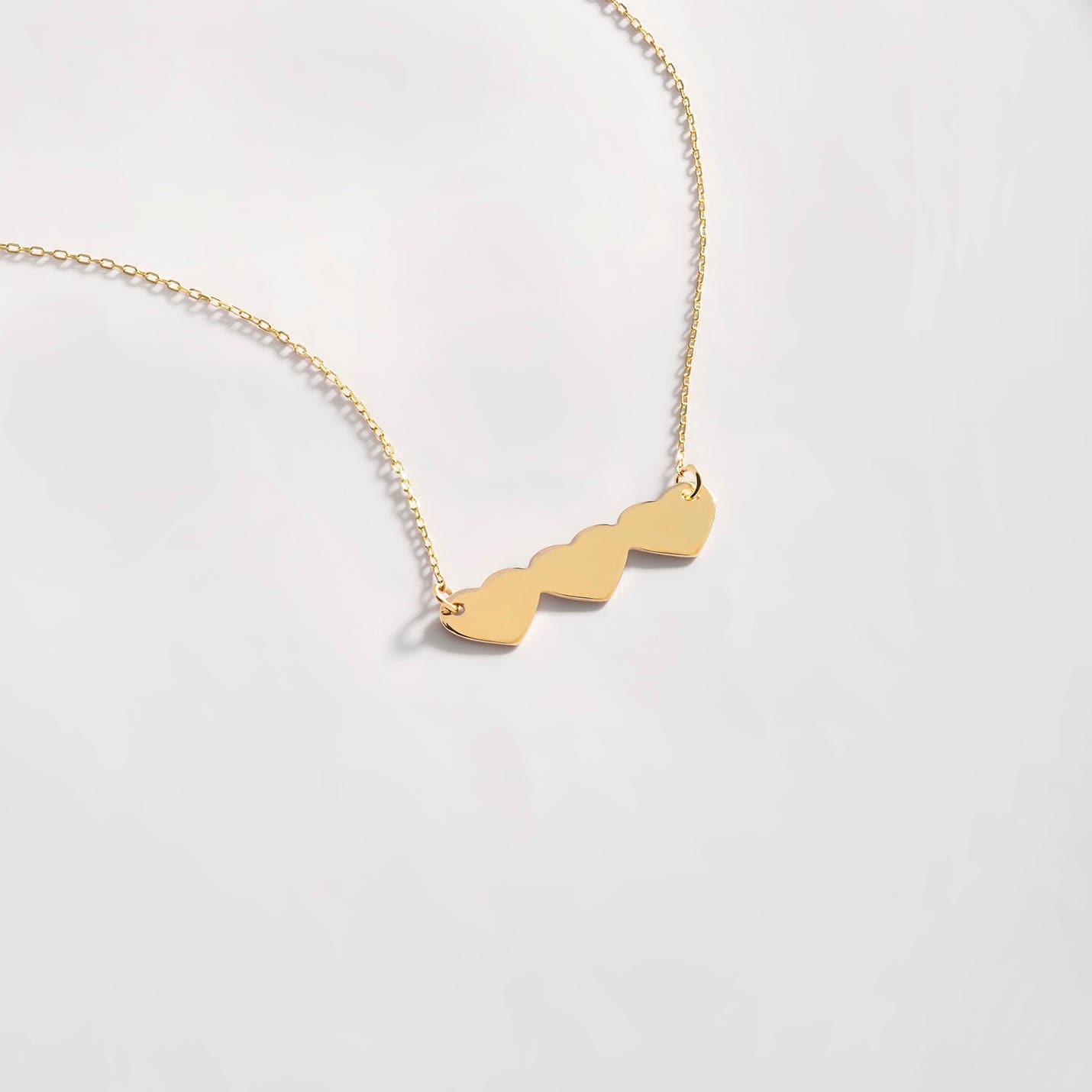 14k necklace with 3 attached shops hearts