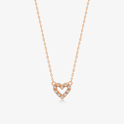 Collier pendentif en forme de coeur ouvert miniature avec diamants d'un poids total de 1/20 CT en or 14 carats.