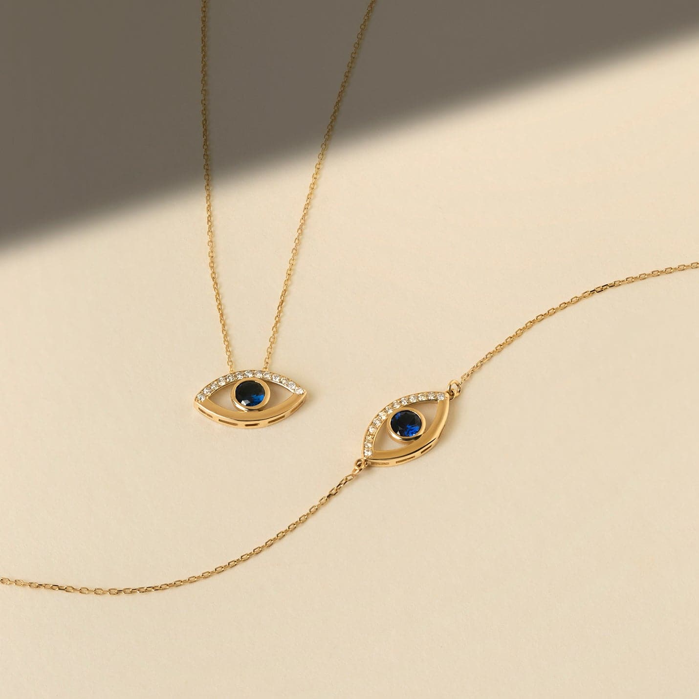 1/15 CT. T.W. Diamond & 1/4 Sapphire Open Evil Eye Pendant Necklace in 14K Solid Gold