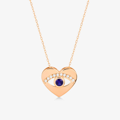 Collier pendentif œil de protection cœur en saphir et diamant de 0,05 CT. et 0,125 CT. en or 14 carats