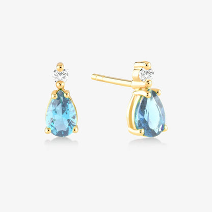 Boucles d'oreilles en or 14 carats avec diamants totalisant 1/20 CT et topazes bleues en forme de poire totalisant 1 CT.