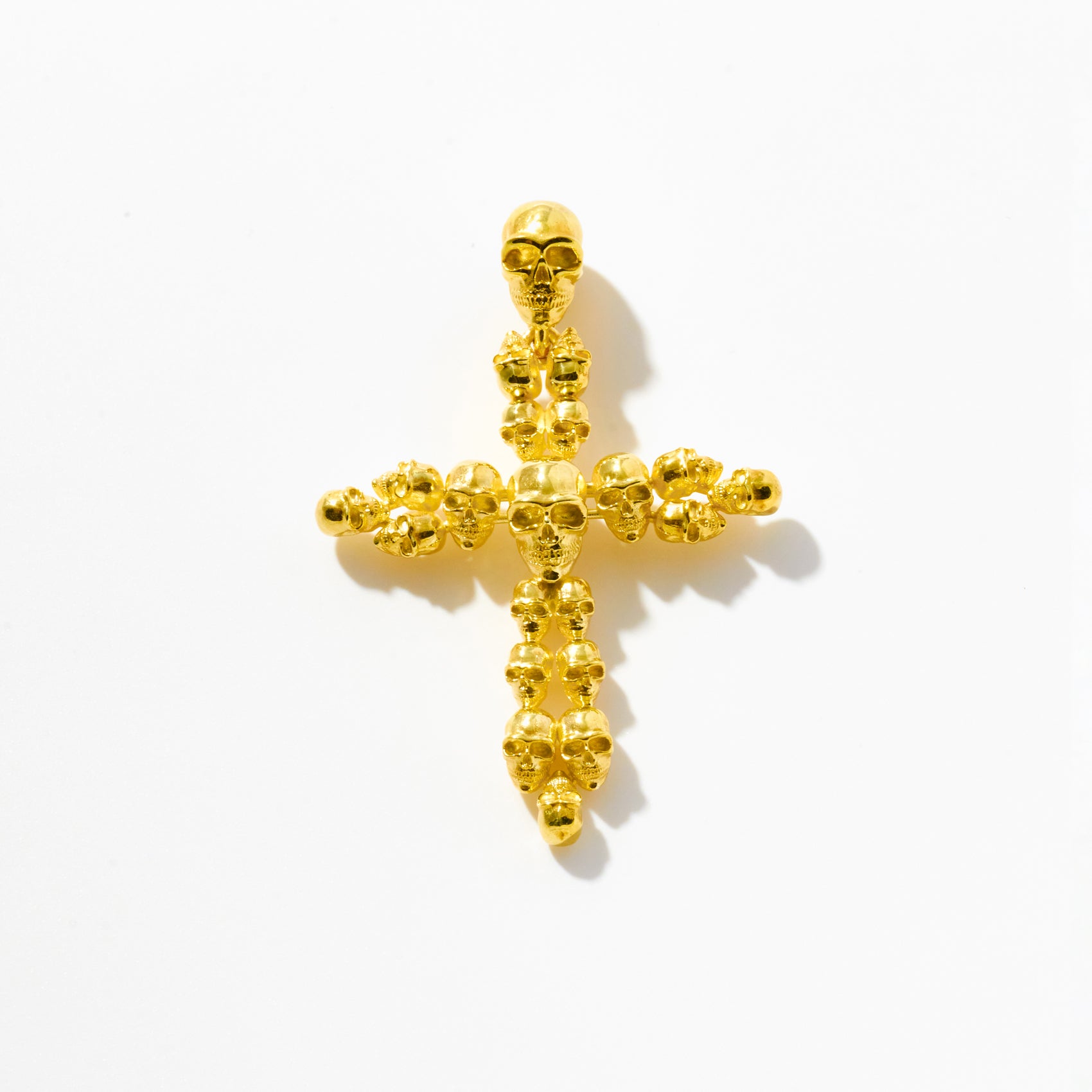 Gold Multi-Skull Cross Pendant
