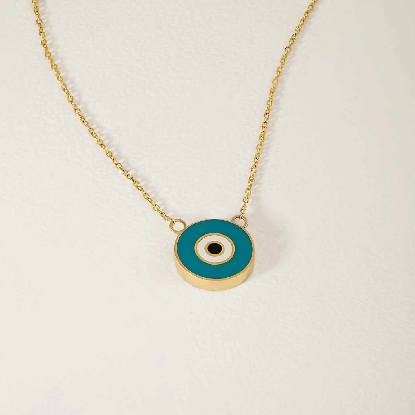 Collier pendentif mauvais œil en turquoise et or 14 carats